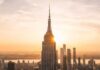 Empire State SHOCKER: Spire Breach Sparks Felonies New York City skyline at dusk with skyscrapers.