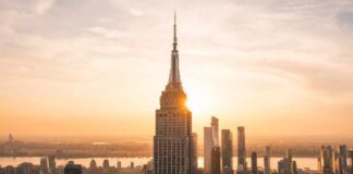 New York City skyline at dusk with skyscrapers.