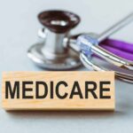 Wooden block with MEDICARE text next to a stethoscope