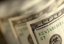 Billionaire Bet Supercharges Kids’ Stock Accounts Close-up of a stack of hundred dollar bills