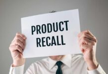 ALERT: Glass In Dinner Rolls! Person holding a sign reading product recall