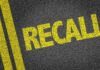 Exploding Grill Chaos Triggers Huge Recall Yellow 'RECALL' text on a dark asphalt surface