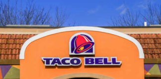 Exterior view of a Taco Bell restaurant with a colorful sign