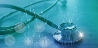 A stethoscope on a wooden surface with digital health icons and a heartbeat graph overlay