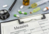 Record Measles Surge — What’s Driving It? Medical supplies including a stethoscope, syringes, and medication related to measles