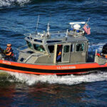 Deadly Harbor Horror Near Lady Liberty U.S. Coast Guard boat on the water.
