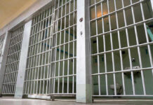 Lightning Blast Rocks Ohio Prison Empty prison cell with metal bars and toilet.