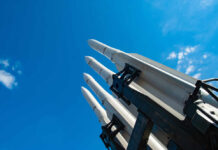 Patriot Crunch Alarms Europe Missile launcher pointing skyward against a bright blue sky