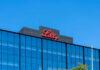 Lilly logo on a modern glass building rooftop