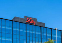 Lilly logo on a modern glass building rooftop