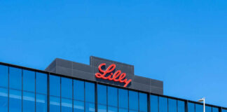 Lilly logo on a modern glass building rooftop