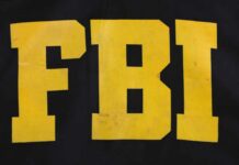 Judge Freezes FBI HQ Flip FBI logo displayed in large yellow letters on a black background