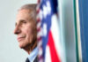 Anthony Fauci close-up with flag.
