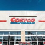 Exterior view of a Costco Wholesale store with shopping carts in front