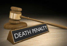 DEATH: Court Drops The Hammer Gavel beside death penalty sign on desk