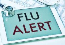 Flu Breakthrough, Seniors Get Caution Tablet displaying a flu alert message with a stethoscope nearby