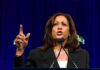 Woman speaking passionately at a podium.
