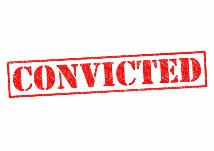 Red stamped text convicted on white background