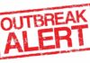 Outbreak alert stamp in red with distressed texture