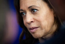 Kamala Harris with serious expression looking off-camera.