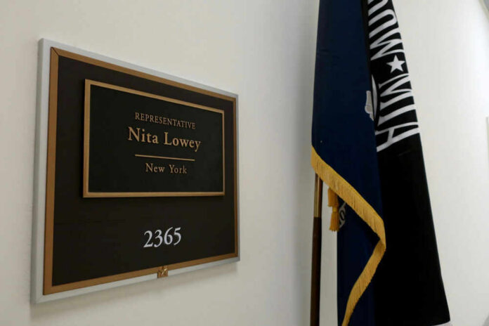 shutterstock_1382592788 Former Rep Nita Loweys office plaque