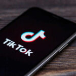 TikTok Shock: Food Recalled After Viral Video TikTok logo on smartphone screen.