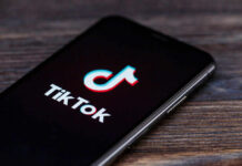 TikTok Shock: Food Recalled After Viral Video TikTok logo on smartphone screen.
