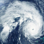 Forecast Whiplash Over Bertha Satellite image of a hurricane over the ocean.