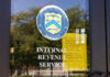 IRS office entrance door with agency seal and notice