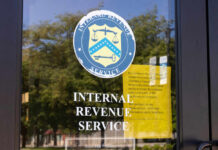 IRS Letters Hint At Free Money – Did You Get THIS? IRS office entrance door with agency seal and notice
