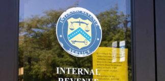 IRS office entrance door with agency seal and notice