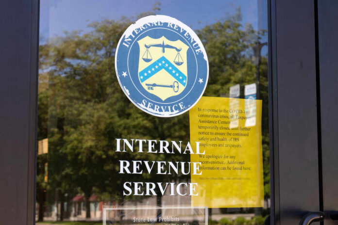 IRS office entrance door with agency seal and notice
