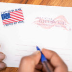 AIPAC Money Tsunami Flips Blue Stronghold Hands addressing an official election mail envelope