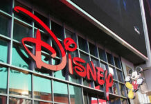 Disney Slammed Again – Key Details Here Disney sign on building with Mickey Mouse figure