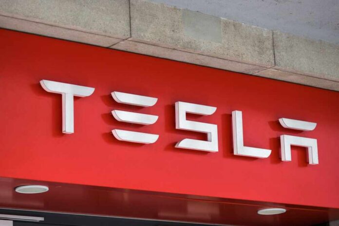 Zurich,,Zurich,switzerland,-,06,11,2022:,A,Sign,Of,A Tesla logo displayed on a red background