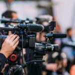 Breakfast Bet Backfires: 16 Restaurants Gone Video cameras on tripods at a media event