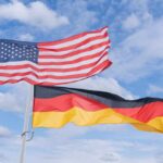 ALERT: Kremlin Threatens Berlin With Attack – DETAILS Flags of the United States and Germany waving against a blue sky