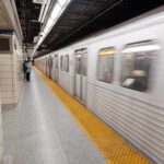 Subway train arriving at an underground platform