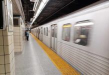 Subway train arriving at an underground platform