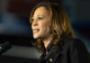 Kamala Harris speaking at a microphone