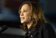 Kamala’s Bizarre Accent Surfaces AGAIN! Kamala Harris speaking at a microphone