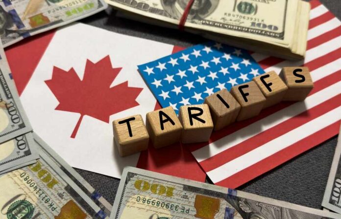 Tariffs,Between,The,United,States,And,Canada.,Usa,And,Canadian Wooden blocks spelling tariffs on U.S. and Canadian flags with dollar bills