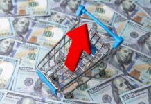 Fast-Food Price Shock Sparks Deal Frenzy Shopping cart with red upward arrow on US hundred dollar bills