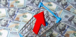 Shopping cart with red upward arrow on US hundred dollar bills