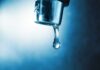 EPA Flags Abortion Drugs in Drinking Water Water droplet hanging from a metal faucet
