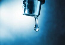 EPA Flags Abortion Drugs in Drinking Water Water droplet hanging from a metal faucet