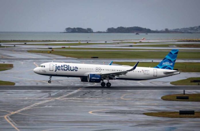Boston,,Us,-,Oct,08,,2025:,Jetblue,Airplane,Landing,In jetBlue airplane taxiing on a wet runway near the coast