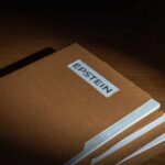 Stack of brown file folders with a label reading 'EPSTEIN'