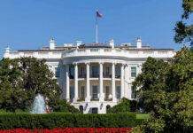 White House with trees and fountain.