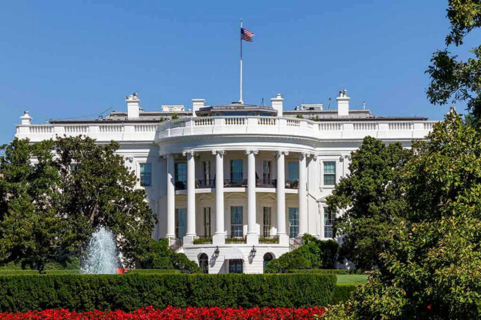 1811895334 White House with trees and fountain.